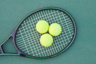 tennis racquet and balls