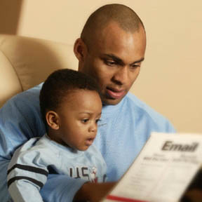 aa dad reading reading to preschool son