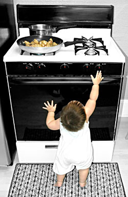 toddler-boy-reaching-for-stove
