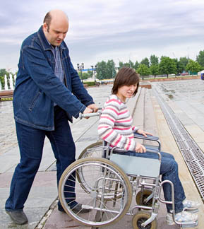 dad-pushing-teen-daughter-in-wheelchair