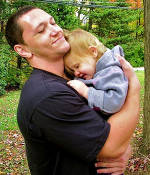 dad-hugging-preschool-daughter-outside