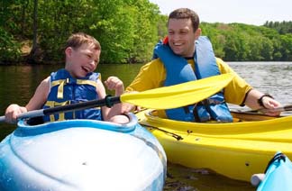 dad-school-age-son-kayaks