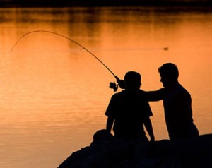 dad-teen-son-fishing-sunset-silhouette