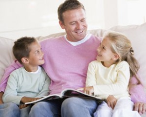 dad-2-school-age-kids-reading-couch