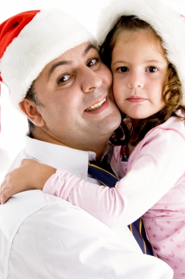 dad-hugging-preschool-daughter-Christmas-hats