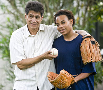 hisp-dad-teen-aa-son-arm-around-baseball