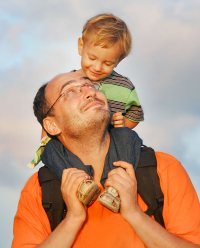 father and son on sky background