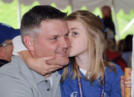 FOY dad school-age daughter kissing cheek